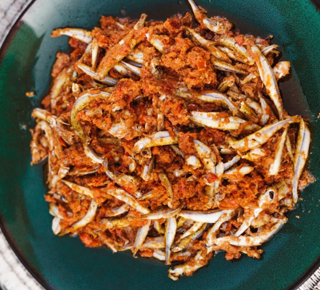 smelt fish in a dry-fried njangsa sauce served in a bowl