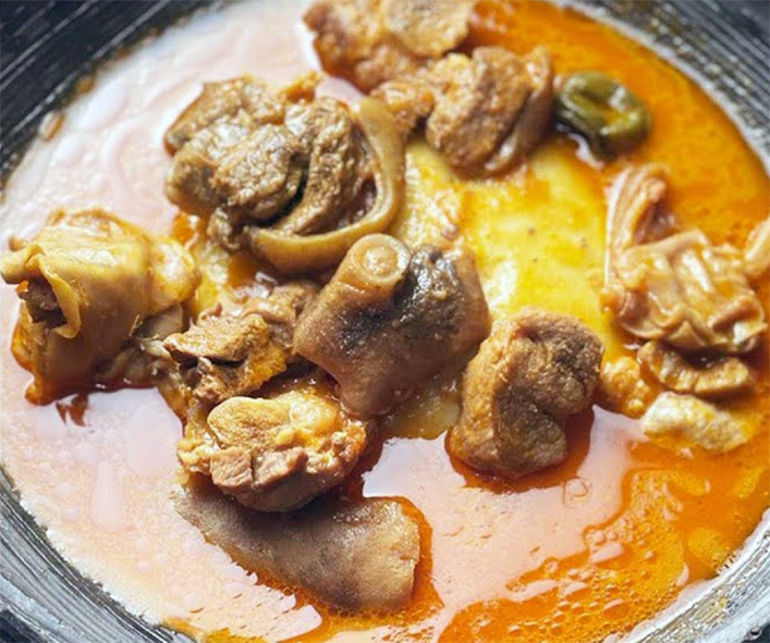 goat meat light soup served in a bowl