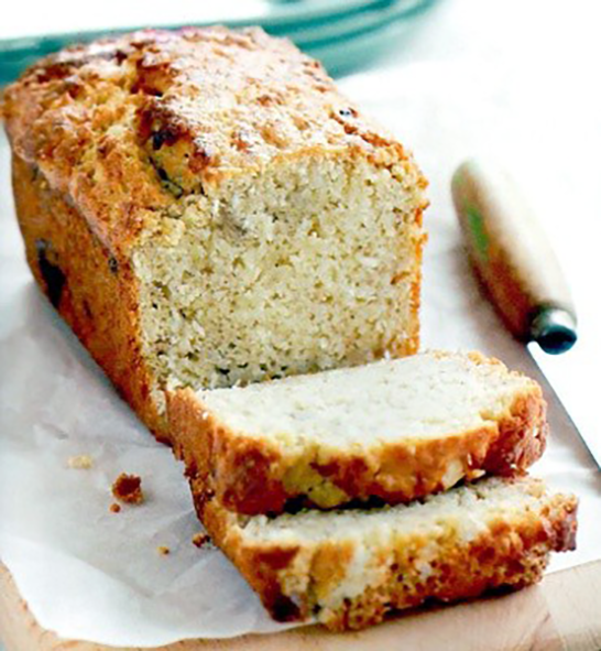loaf of Malawi banana bread with two slices cut from the loaf and arranged in front</a>