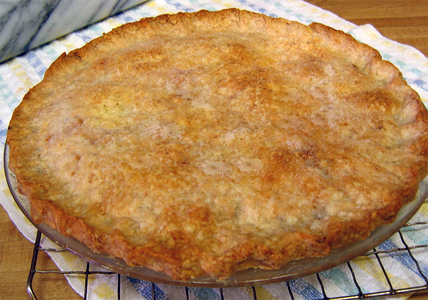 fish pie with oatmeal crust cooling on a wire rack