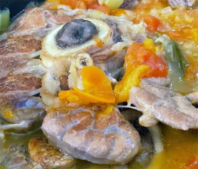 shin of veal with orange zest in a casserole dish