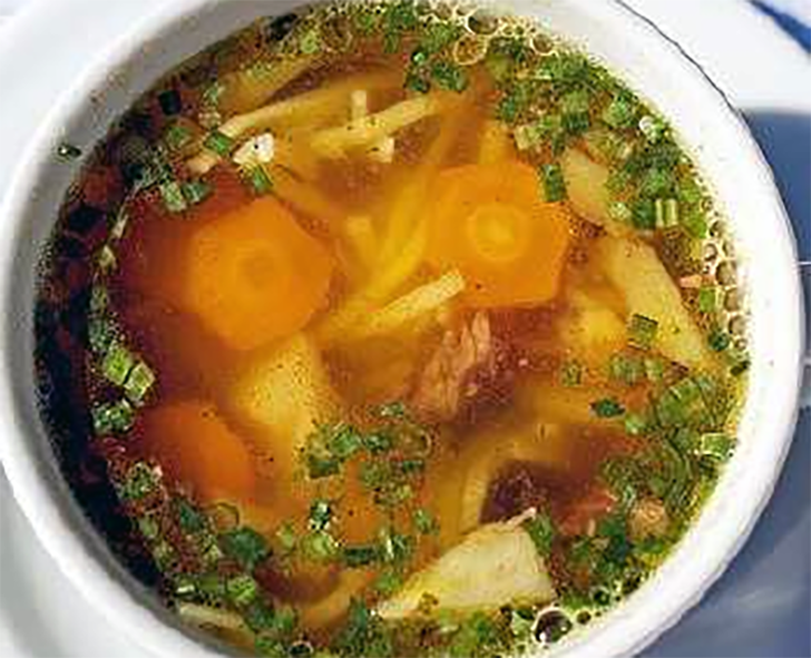ox cheek and vegetable soup in a bowl