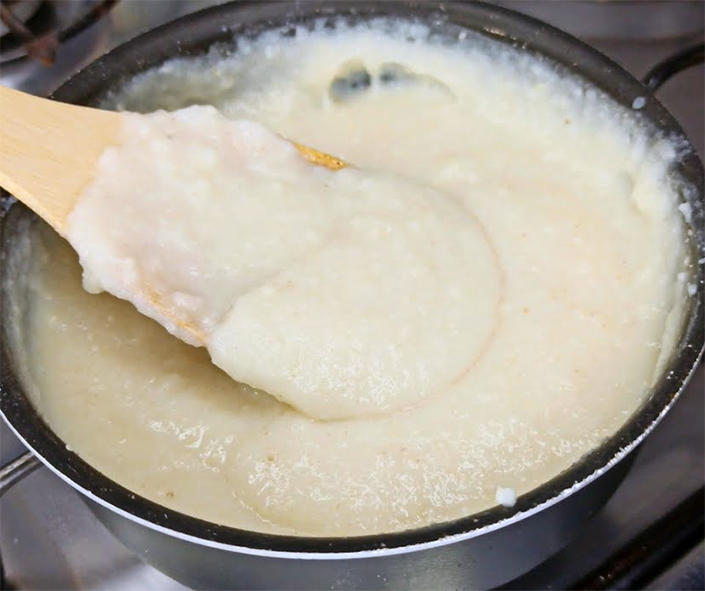 cassava porridge stirred in a saucepan