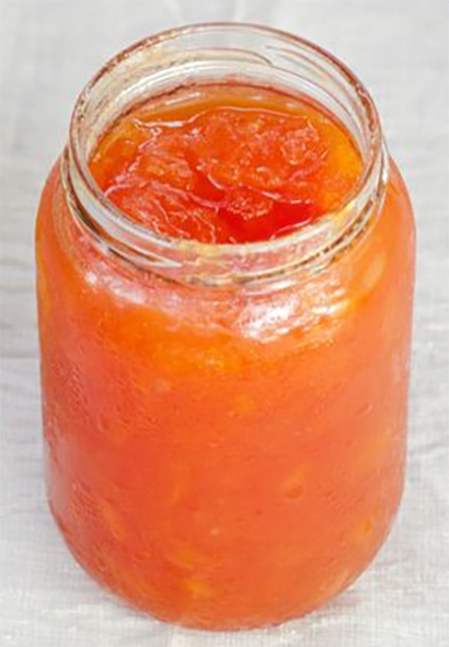 Papaya jam in an unlidded jam jar