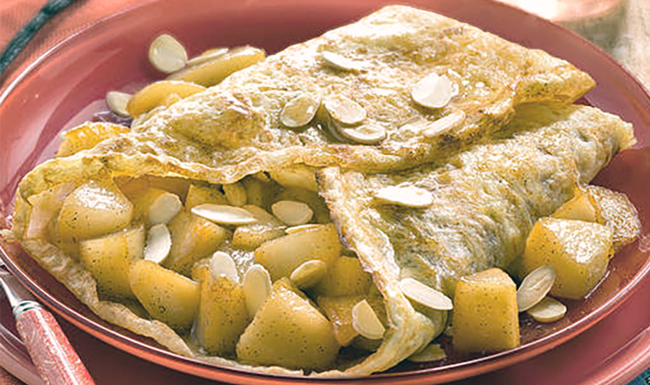 pear and almond filled crepe on a plate
