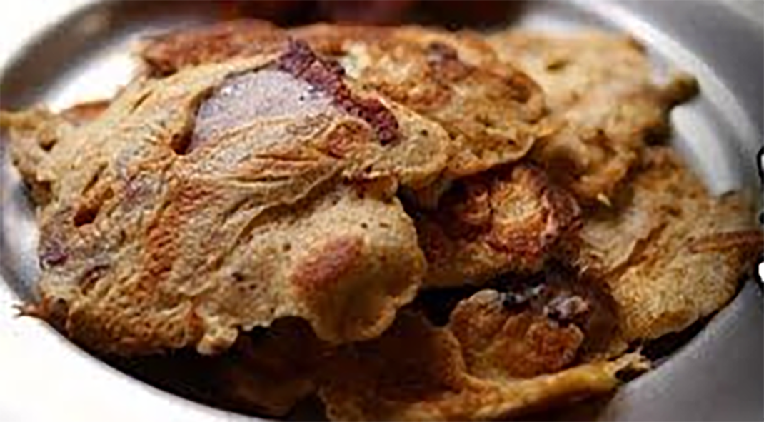 bacon coated and fried in batter served on a pewter plate