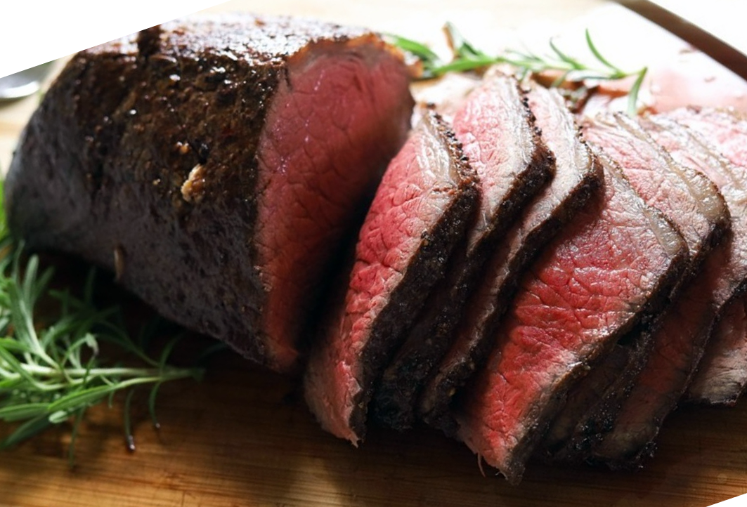 roast rump of beef on a chopping board