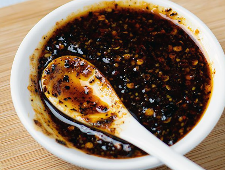 apple and shrimp ballachong served in a small dish with a spoon
