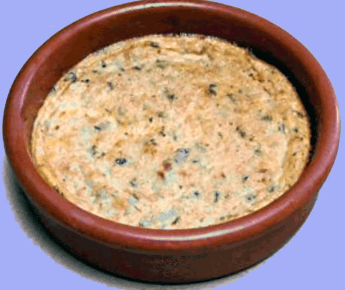 baked white bean and egg yolk tansy in an earthenware dish