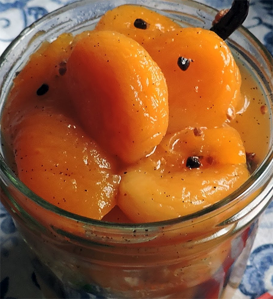 dried apricots in syrup in a glass jar