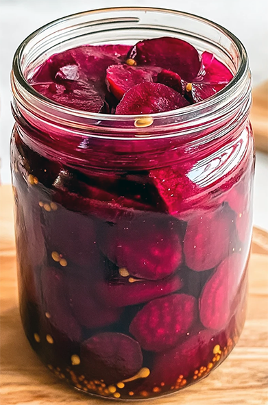 pickled sliced beetroot in a glass jar