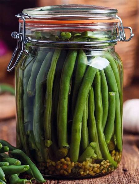 pickled French beans in a glass jar