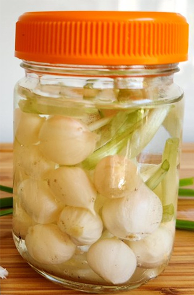 pickled three-cornered leek bulbs in a jar