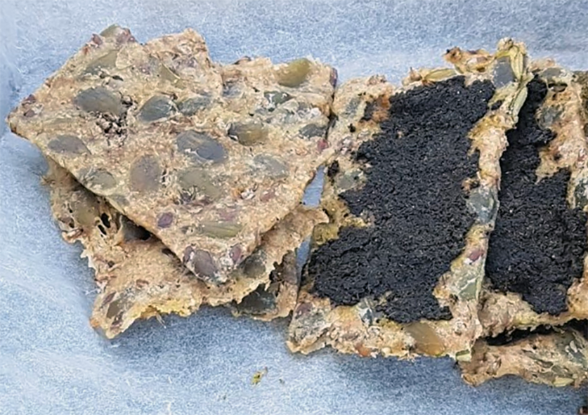 stack of plantain seed and mixed seed crackers topped with nettle powder paste</a>