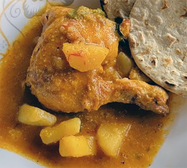 pollo en pinol served with bread