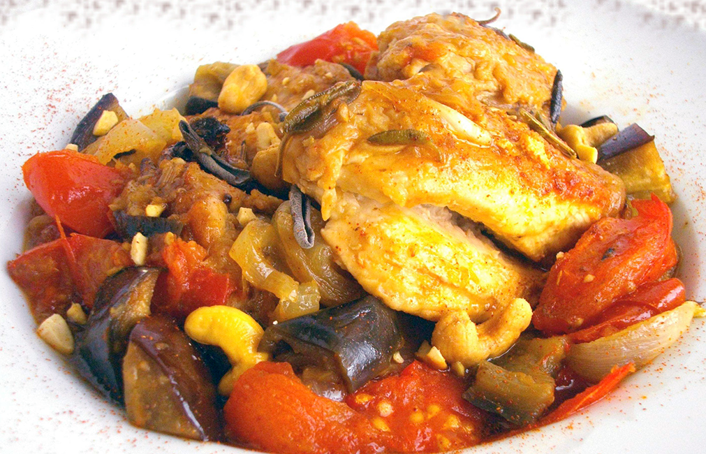 local chicken cooked with tomatoes, potatoes, aubergine and scotch bonnet chilli served on top of the sauce