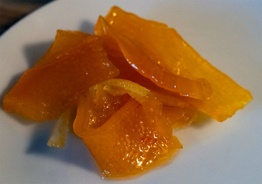 preserved pumpkin skin confit served on a plate