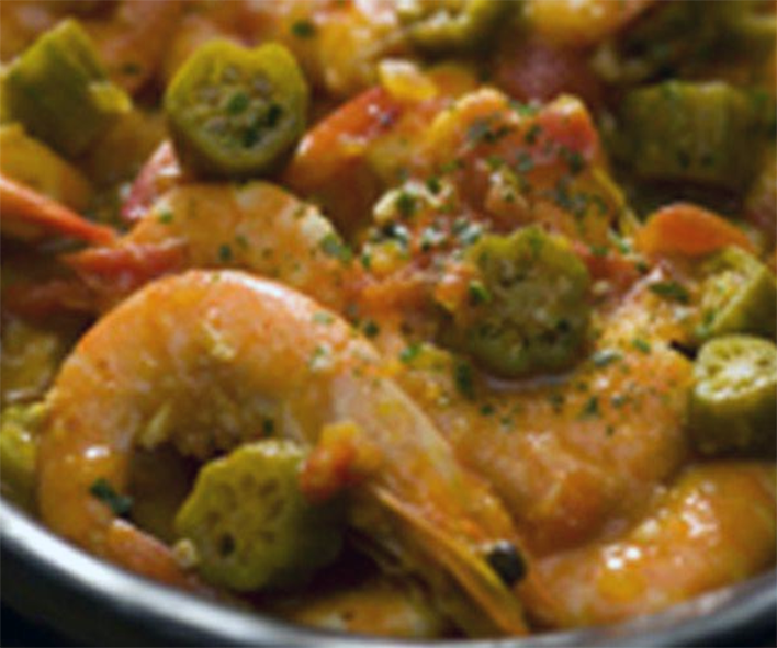 prawns with okra in red oil served in a steel bowl