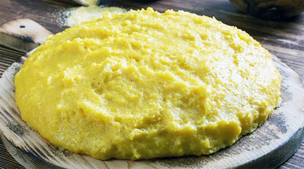 romanian polenta turned out on a wooden board