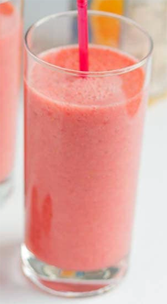 raspberry orange smoothie in a tall glass