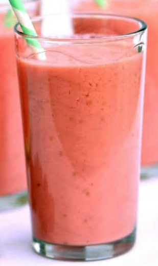 raspberry watermelon smoothie in a tall glass with a straw