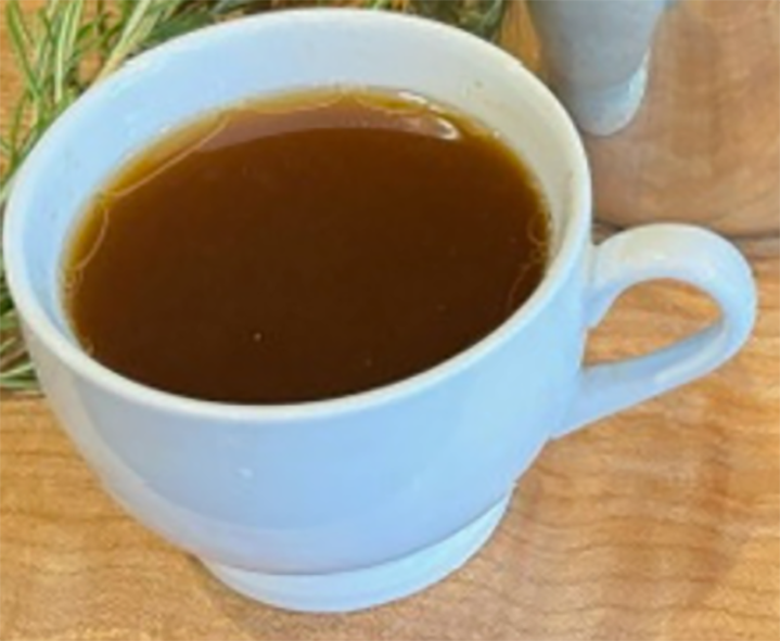 rich meat stock in a cup