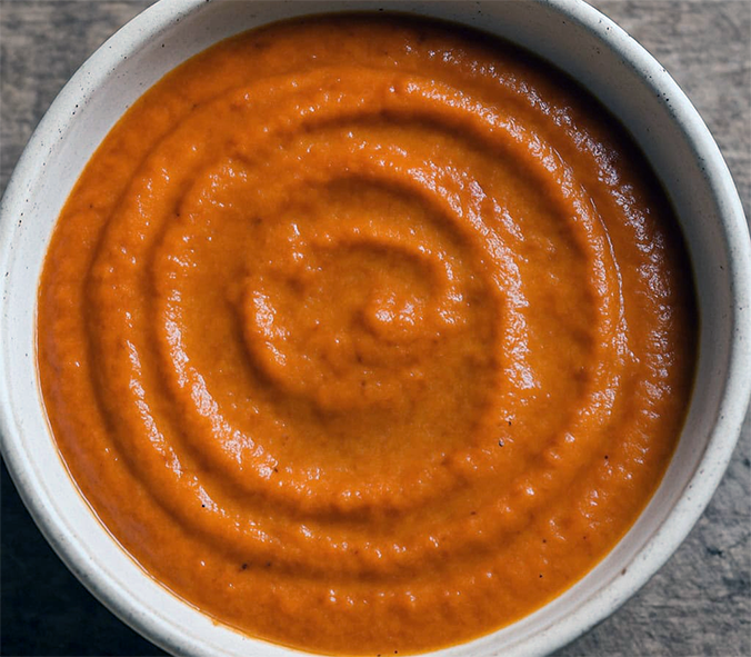 roasted red bell pepper and garlic sauce in a bowl