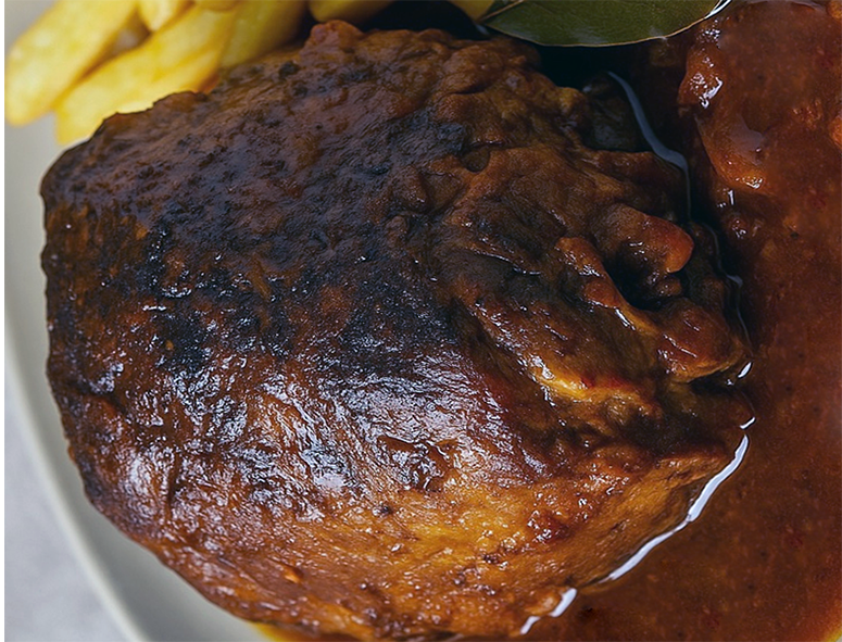 Cypriot beef braised in red wine served with chips and a sauce made from the wine stock