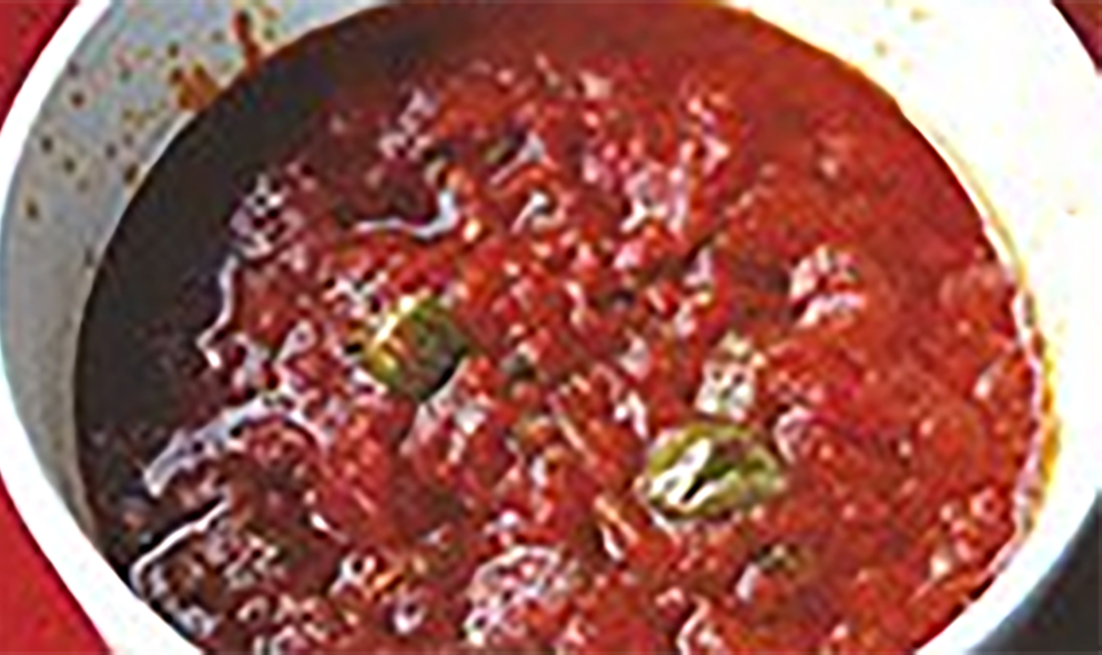salsa pizzaiola simmering in a saucepan