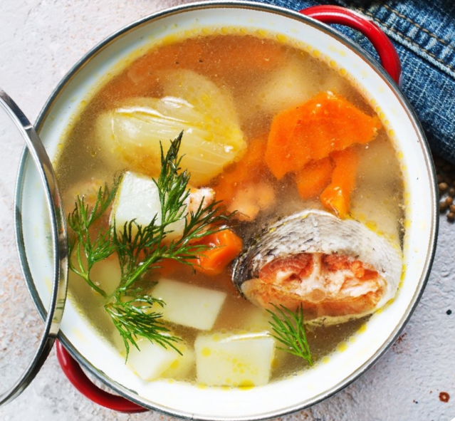 Salvadorean fish head soup in a lidded casserole dish