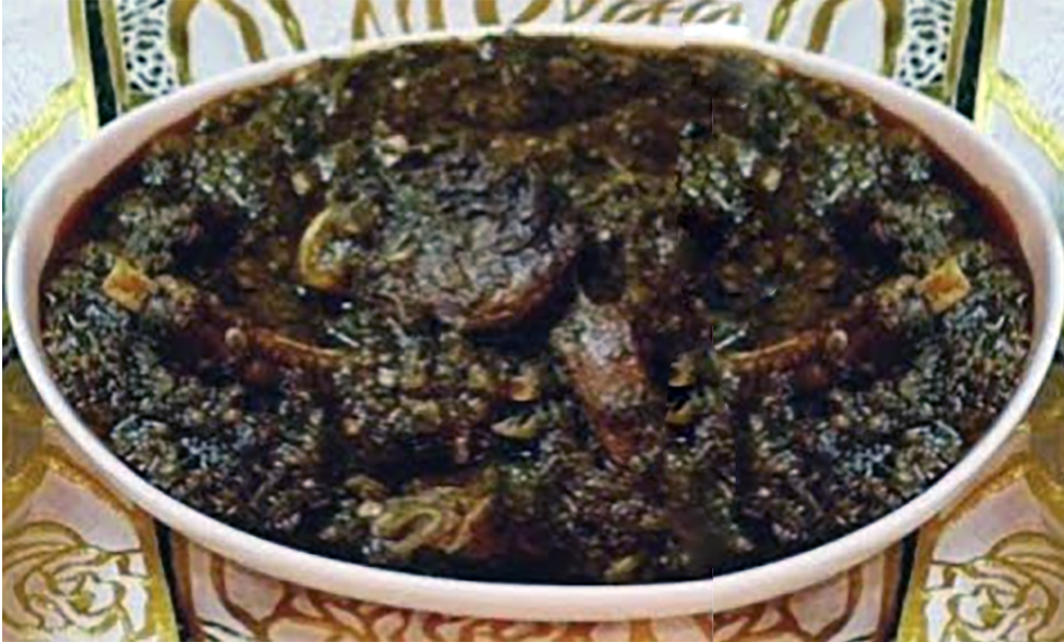 sauce of meat and dried fish in a locust bean and hibiscus leaf base served in an oval dish