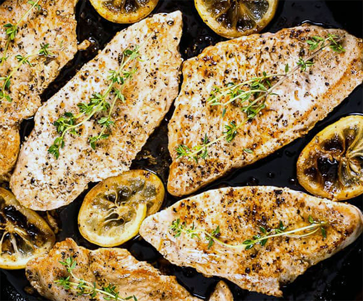 turkey breast cutlets in a griddle pan