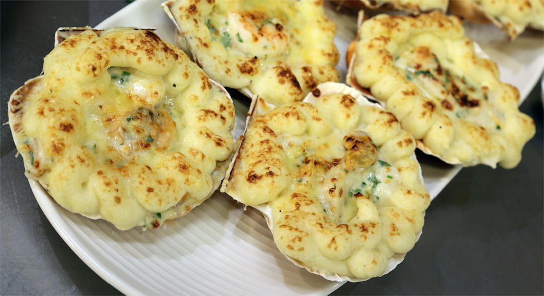 Individual fish pies with mash topping baked in scallop shells