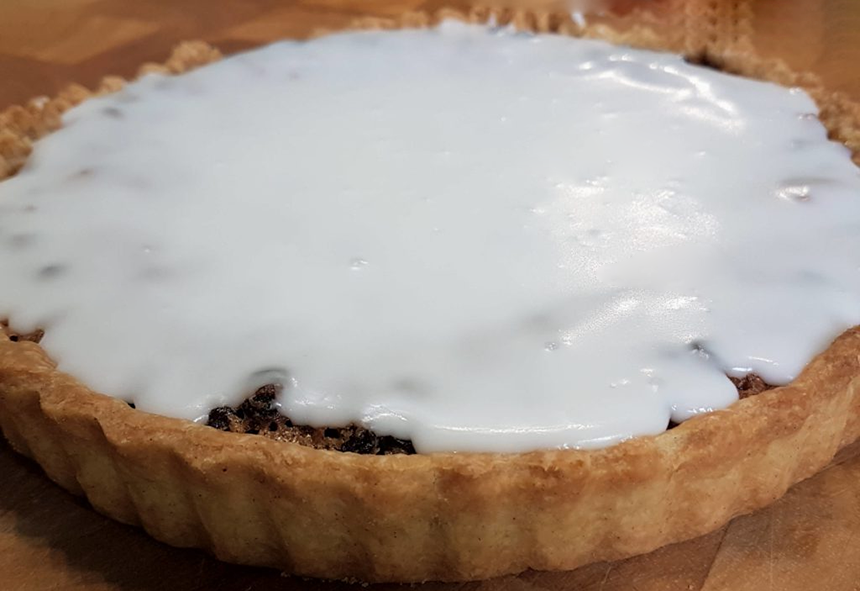 classic scottish borders fruit tart topped with white icing