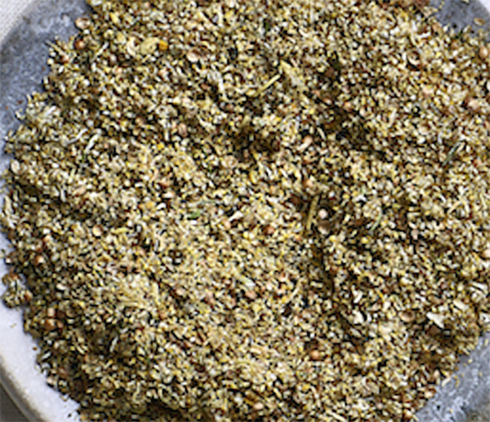 blend of sea plantain and stinging nettle seeds with chamomile flowers on a plate