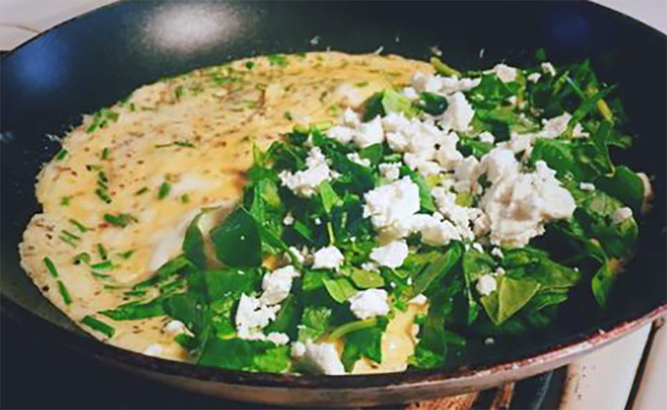 two egg omelette with a filling of spinach and chives with seaweed