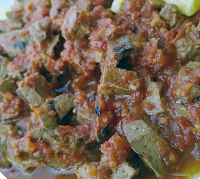 cubed calf liver in a tomato, onion and chicken stock sauce