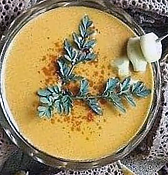 Ethiopian siljo served topped with garlic, rue and paprika in a glass dish