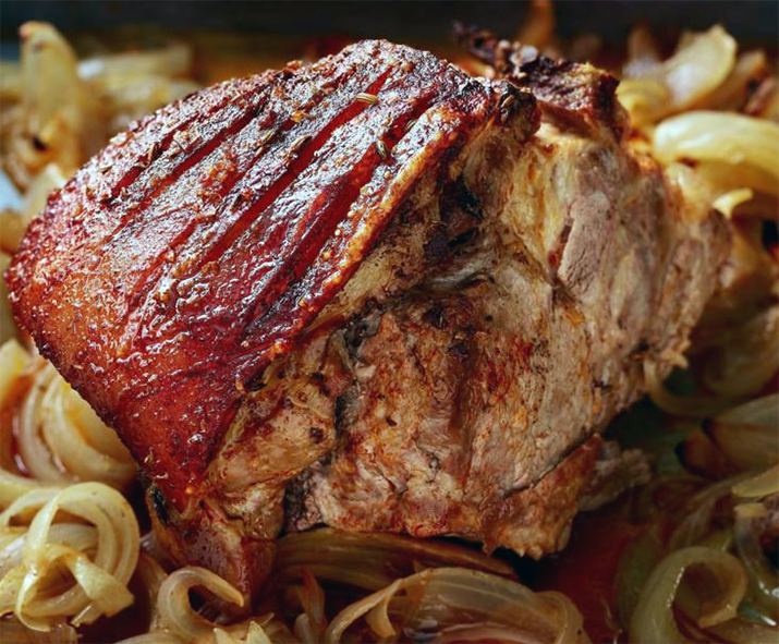 slow-roasted pork shoulder on a bed of onions
