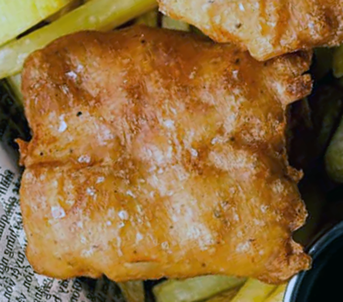 deep fried fish in yeasted batter served on newspaper with chips
