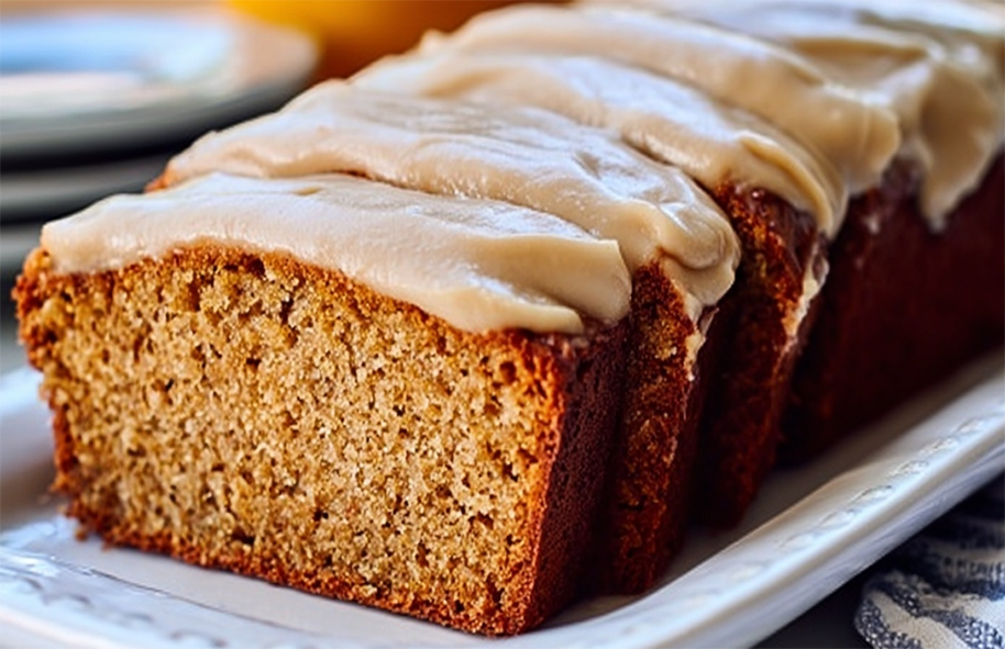 sliced spiced honey loaf cake topped with condensed milk icing