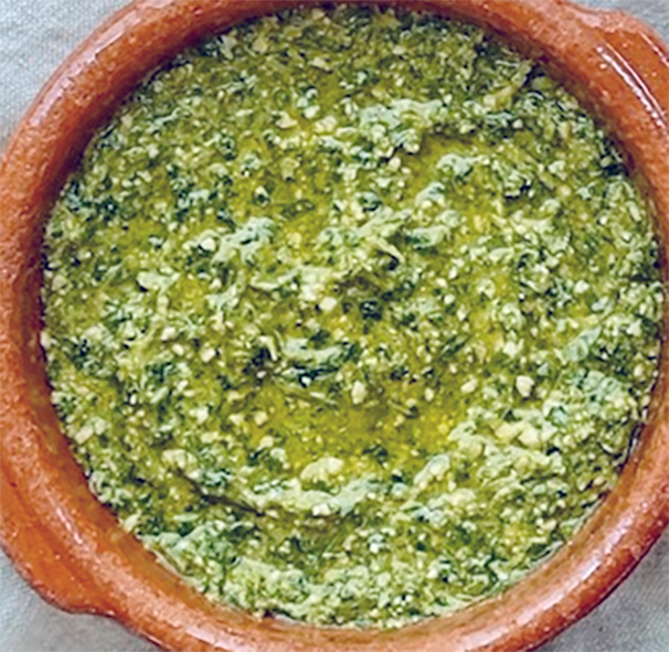 coriander and jalapeno pesto with himalayan balsam seeds and lime in a bowl