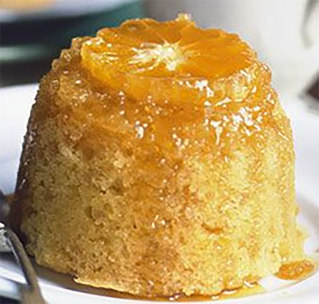 steamed ginger and citrus cake served topped with orange and hot syrup