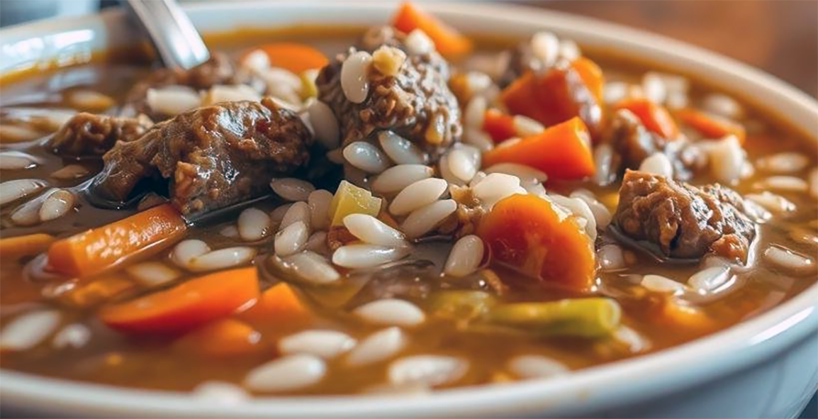 beef, vegetable and rice soup in a soup bowl