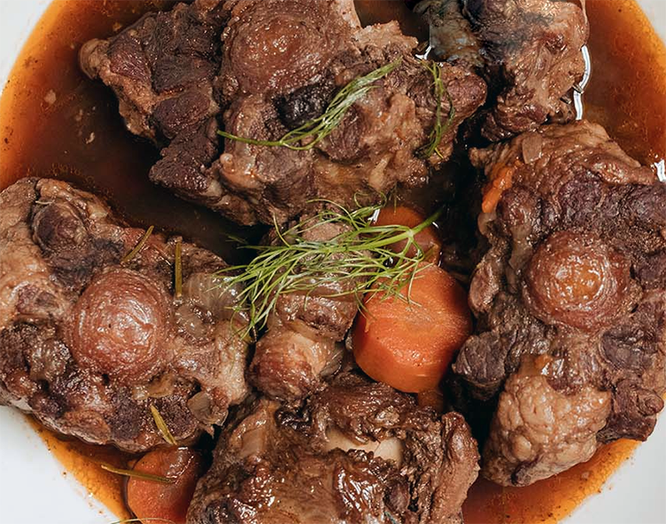 oxtail stew with carrots served on a plate