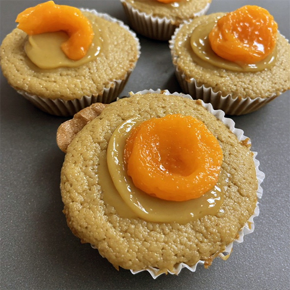 pumpkin muffins topped with dulce de leche and a dried apricot