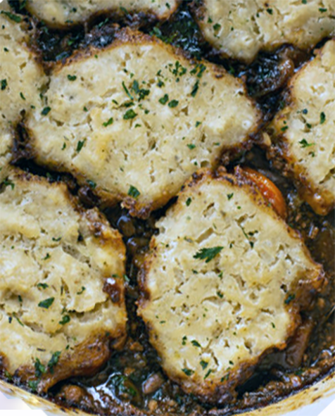 suet and parsley dumplings on top of a stew