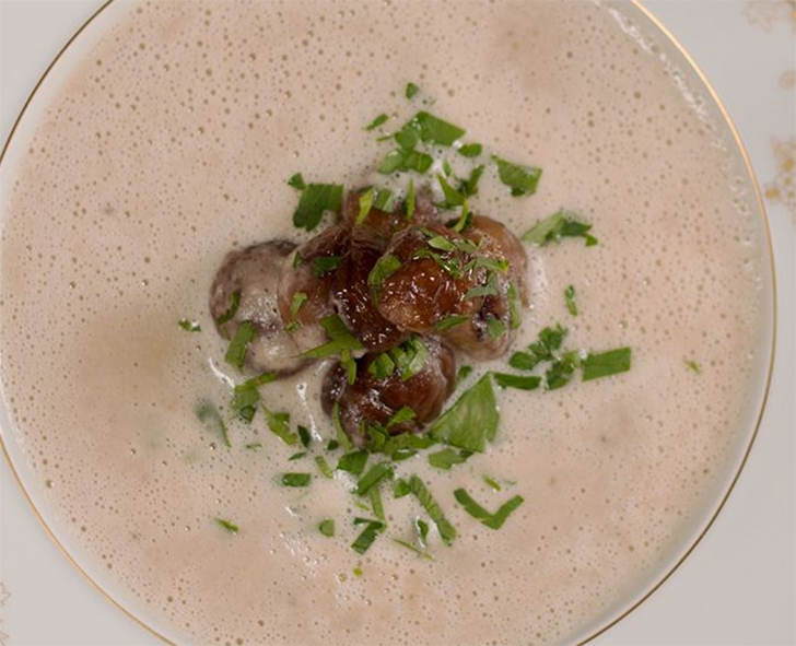 sweet chestnut soup garnished with sweet chestnuts and chopped chives