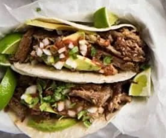 Two pulled pork (carnitas) tacos