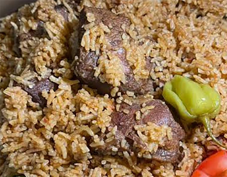 beef pieces and hot chilli on a bed of rice